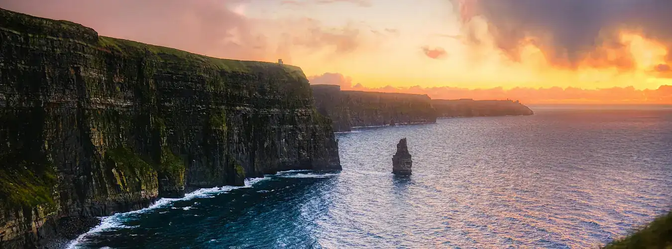 Irish sea cliffs above the Atlantic at sunset